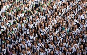 Manila, Philippines: Students make a Number One sign as they take part in the One Billion Rising campaign