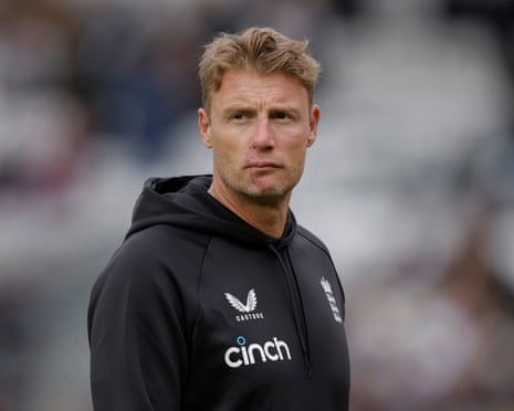 Midshot of Flintoff in hooded tracksuit top with background blurred