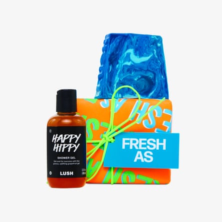 A blue swirled soap bar, orange patterned box, and shower gel bottle stand together with a ‘Fresh As’ label