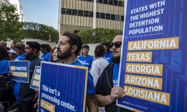Members of criminal justice, disability rights, and immigration organizations announce a class-action lawsuit filed on behalf of thousands of people in Ice detention centers, outside the Royal Federal courthouse in Los Angeles on Monday.
