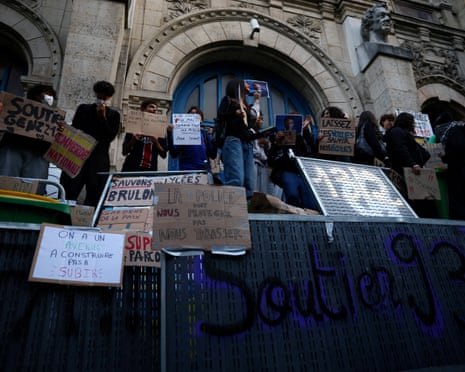 French high school students gather outside the Lycee Voltaire high school in France.