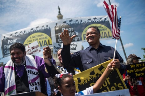 Jesse Jackson speaking at civil rights rally with crowd