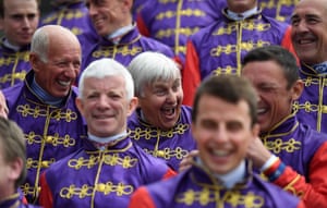 Jockey Willie Carson, centre, with former and present Queen’s jockeys wearing the Queen’s colours at Epsom Downs racecourse