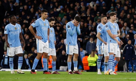 Manchester City’s players look crestfallen after their penalty shootout defeat