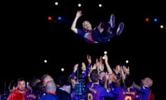 Andres Iniesta is thrown in the air by teammates after his final game for Barcelona