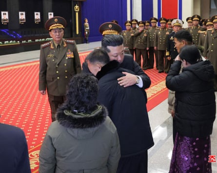 Kim meeting the families of soldiers who were killed