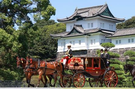 Prince Hisahito leaves the ceremony on a horse-drawn carriage.
