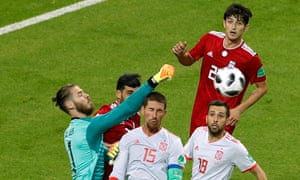 Spain’s David de Gea punches the ball clear.