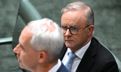 Anthony Albanese listens to Andrew Giles during Question Time.