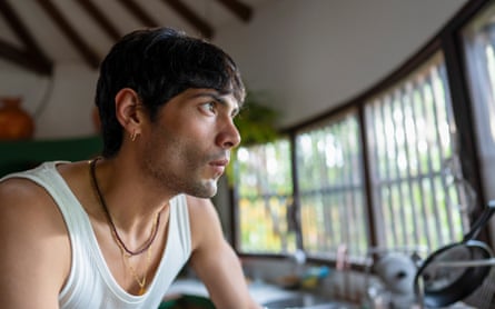 Diego Calva wearing a white vest