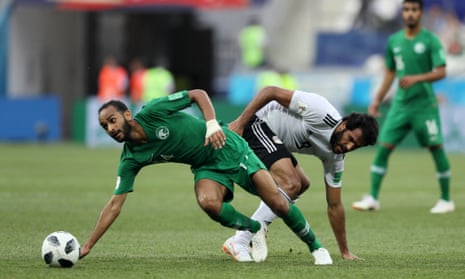Abdullah Otayf of Saudi Arabia battles for possession with Egypt’s Marwan Mohsen.