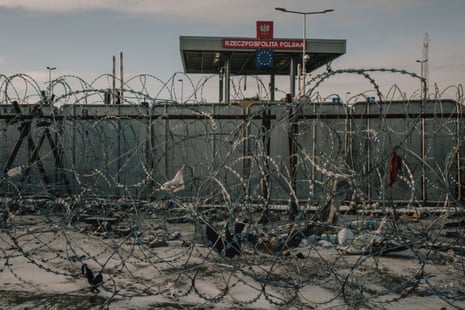 Torn clothing hangs from barbed wire at a border crossing checkpoint on the Polish-Belarusian border near Kuźnica, eastern Poland.