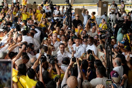 Abelardo de la Espriella surrounded by supporters outside a polling station
