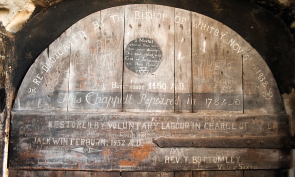 Old wooden door with inscriptions at St Mary’s, Lead