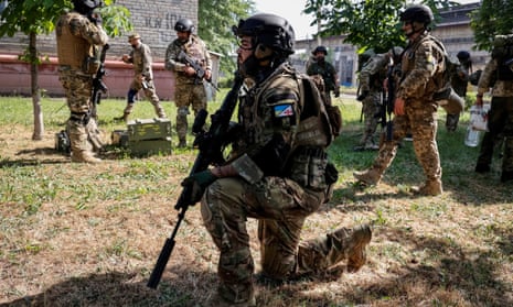 Members of a foreign volunteers unit which fights in the Ukrainian army take positions, as Russia’s attack on Ukraine continues, in Sievierodonetsk, Luhansk region Ukraine June 2, 2022.