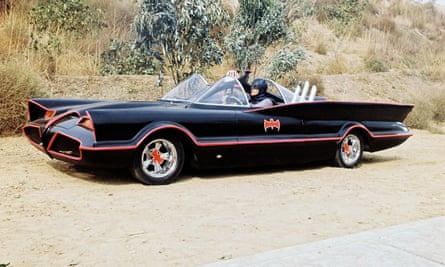 Adam West in the Batmobile from the 1960s version of Batman.