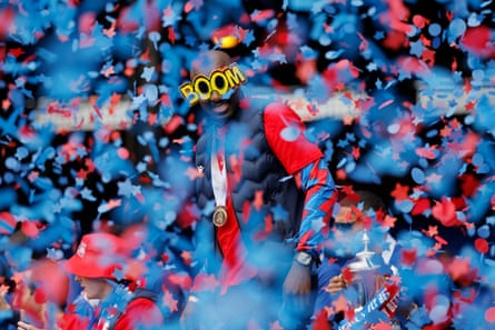 Jean-Philippe Mateta dons some suitable specs as he celebrates at the party on the pitch.