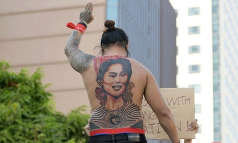 A man with a tattoo of Aung San Suu Kyi takes part in a protest against the military coup 