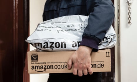 A worker delivering Amazon parcels