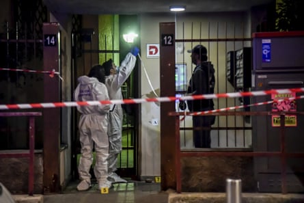 Police investigate near the scene where Vittorio Boiocchi was shot and killed in Milan.