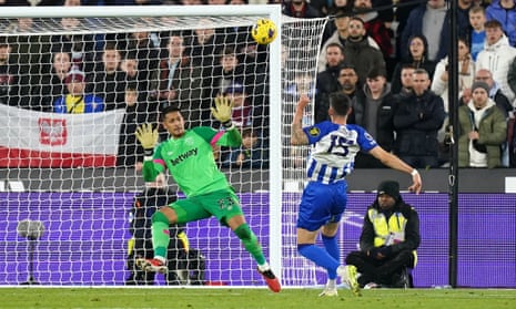 Jakub Moder blasts the ball over Alphonse Areola and the West Ham goal.