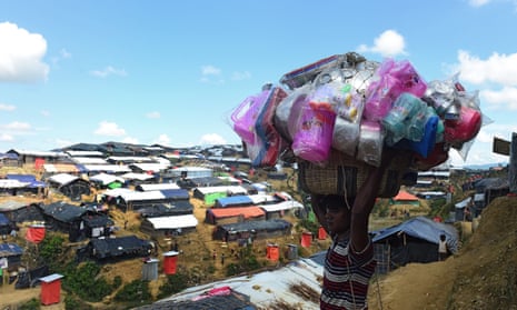 A Bangladeshi street vendor sells household plastic items at Balukhali refugee camp in the Bangladeshi district of Ukhia. 