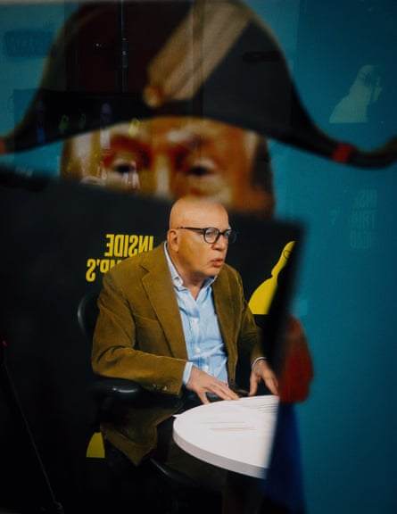 A man speaks at a table
