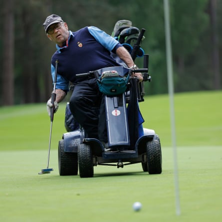 Terry Kirby, a seated golfer with Ganstead Park near Hull, putts on the 14th hole