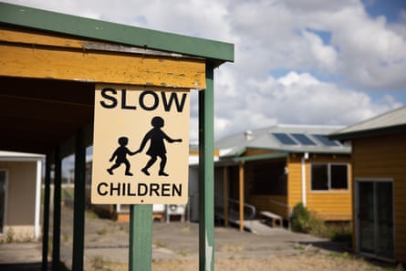 An old sign hangs a the back of the boys’ home.