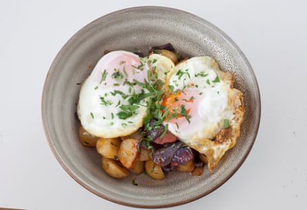 Breakfast-leaning: fried potatoes with nuggets of chorizo, with a fried egg is slumped across.