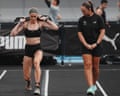 Joanna Wietrzyk carries a heavy sandbag on her shoulders while running at Hyrox Beijing