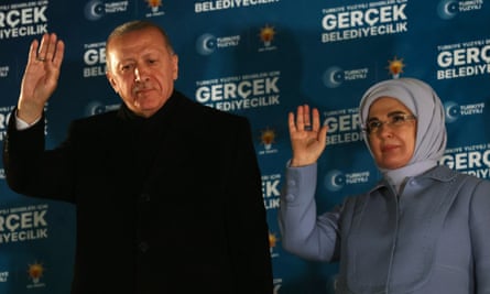 President Recep Tayyip Erdoğan with his wife, Emine, wave to supporters