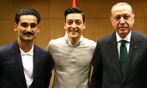 Ilkay Gündogan and Mesut Özil pose for a photo with Turkish President Recep Tayyip Erdogan in May.