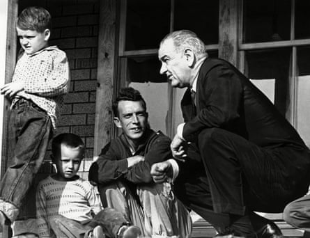 Lyndon Johnson with Tom Fletcher, an unemployed saw mill worker, in Inez, Kentucky in April 1964.