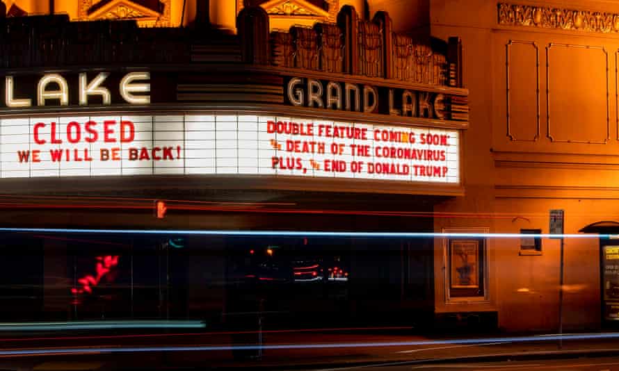 The Grand Lake in Oakland theater displays a message about Donald Trump and the Coronavirus on their marquee