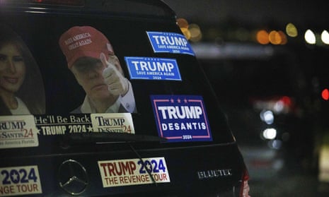 Stickers in support of Donald Trump are displayed on the trunk of a vehicle parked near Mar-a-Lago in Palm Beach, Florida.