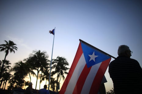 People gather in front of Puerto Rico’s Capitol building on 22 December 2015. (AP Photo/Ricardo Arduengo, File)