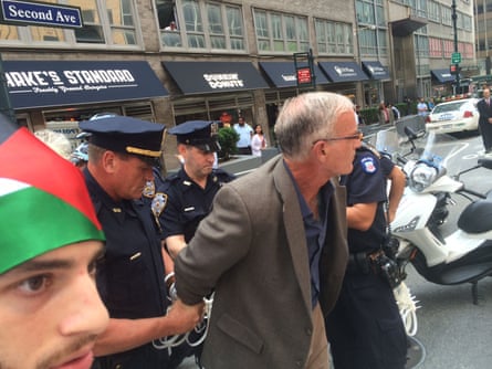 man is handcuffed on NY street