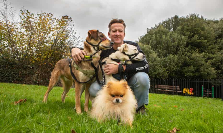 Pen Farthing near his home in Exeter with three dogs he rescued from the streets of Kabul.
