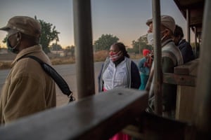 Mupombwi waits at her local bus station in Harare