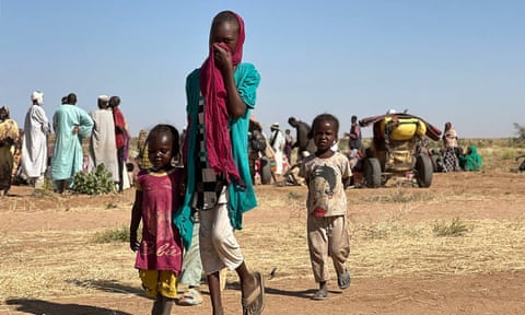 A Sudanese woman and children among displaced people