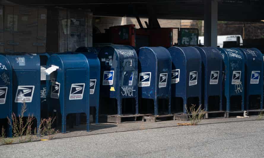 Mail boxes sit in the parking lot of a post office in the Bronx, New York, earlier this month, amid reports that many had been removed from service.