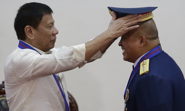 Rodrigo Duterte, shown appointing the Philippines’ new police chief, Ronald Dela Rosa, has pledged to take brutal measures against drug traffickers.