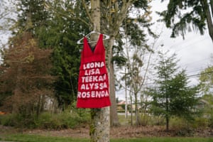 A red dress, symbolizing missing and murdered indigenous women, hangs on a tree at Morrill Meadows Park in Kent, Washington.