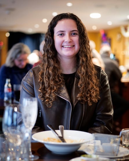 A woman smiling after eating