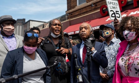 Andrea Jenkins at a vigil for George Floyd with Rev Al Sharpton, centre, and activist Gwen Carr, right, whose son, Eric Garner, who was killed by New York police in 2014.
