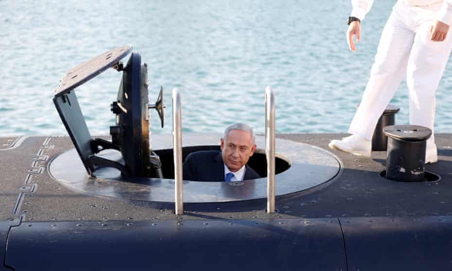 Israeli PM Benjamin Netanyahu climbs out of the submarine Rahav in Haifa.