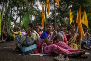 Tribeswomen listen to Salkhan Murmu, former lawmaker and community activist, during a sit-in demonstration to demand the recognition of Sarna Dharma as a religion in Ranchi