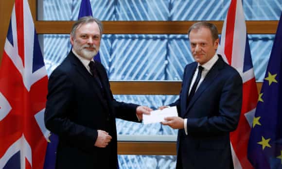 Missing you already: Tim Barrow delivers May's Brexit letter to EU council president Donald Tusk. 