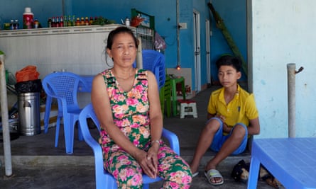 Nguyen Thi Ngoc Tham and her son, Phuc Thinh, at Long Hai beach